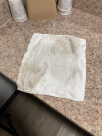 I wiped tables off of the supposedly clean room.