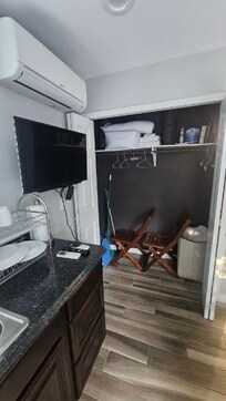 Closet used as storage closet, tv lines a mess, AC that does not work.