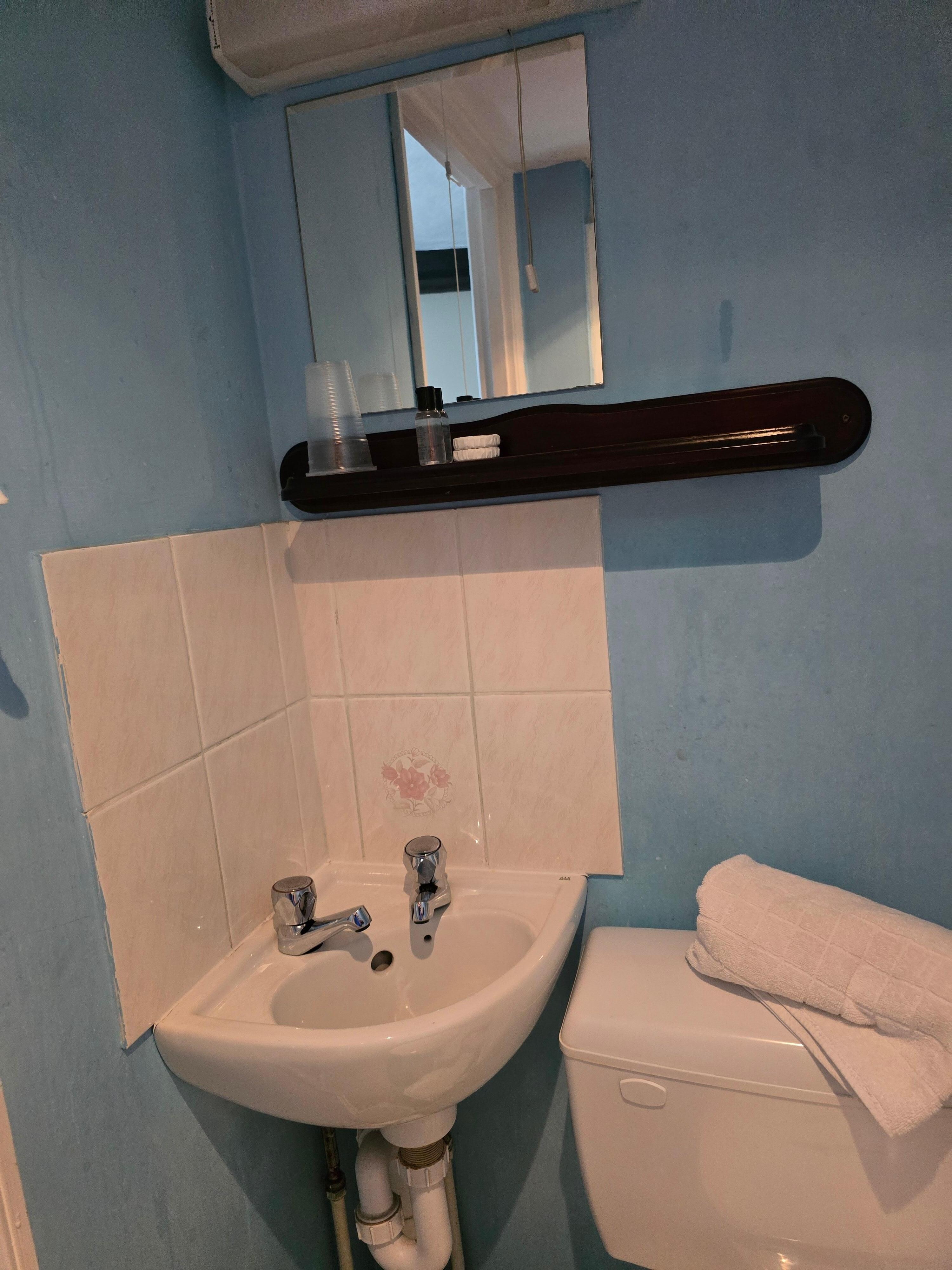 Small clean room with shower.