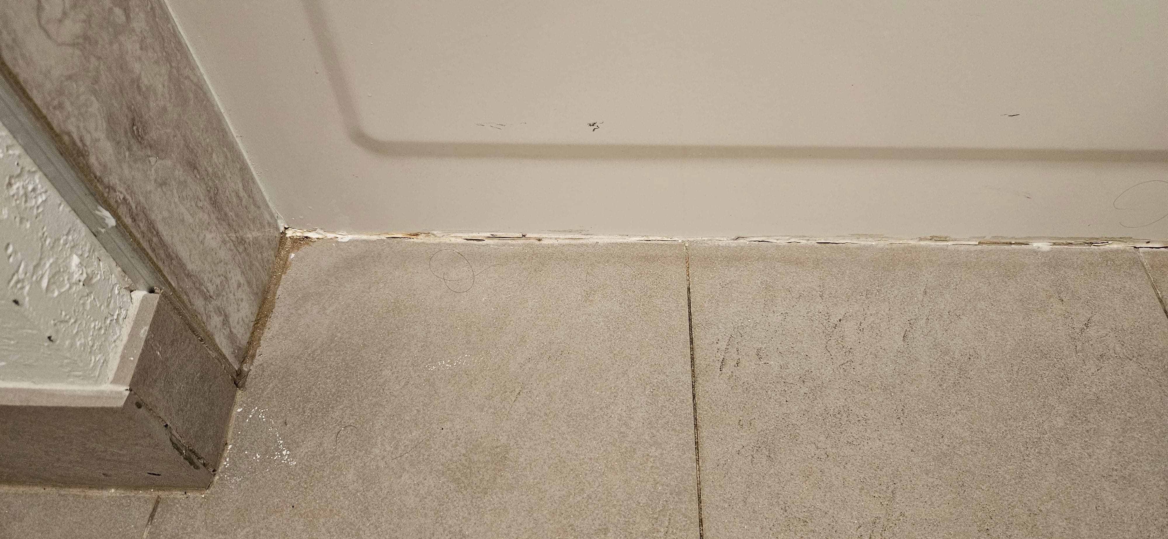 The grout and caulk around the tub was dirty and gross