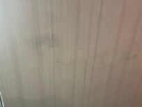 Wallpaper over black mold.