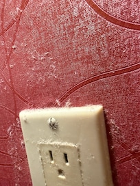 Heavy dust behind and around nightstand plugin