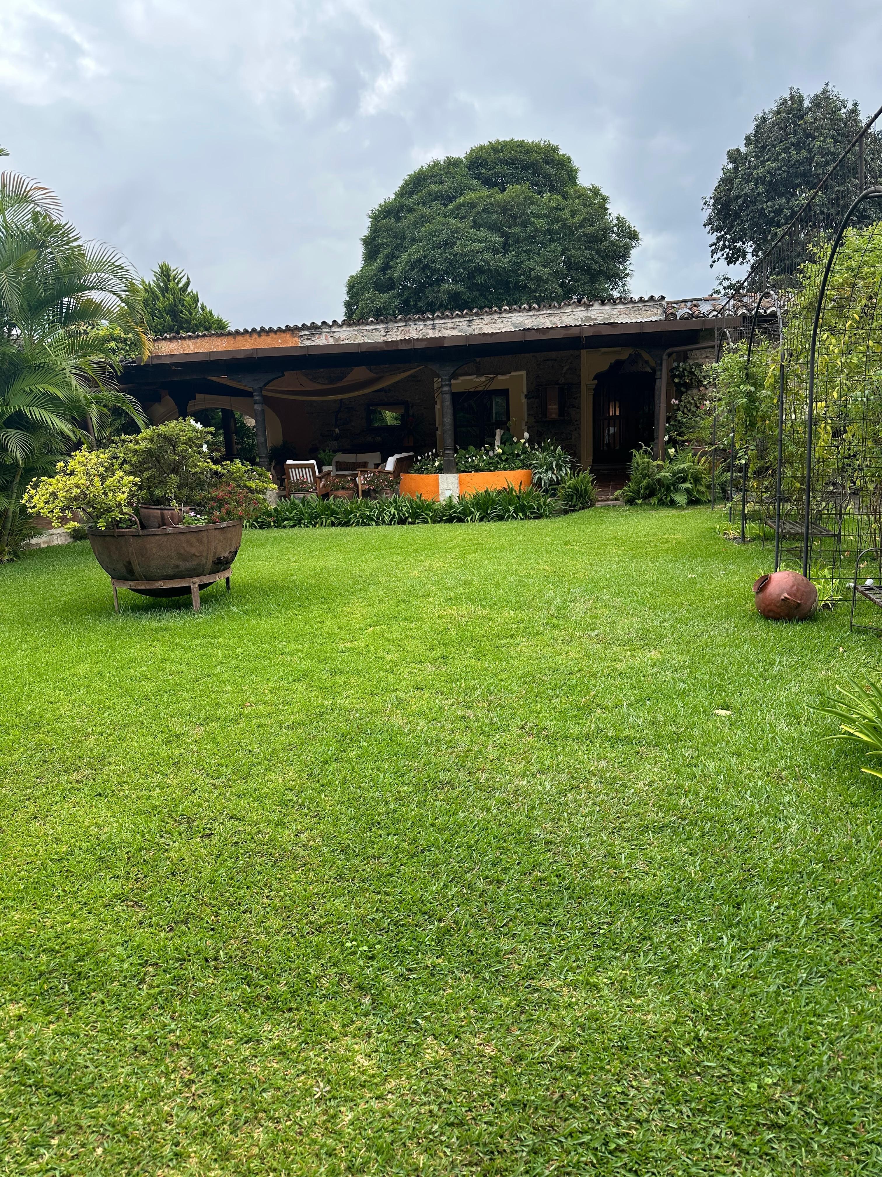 The lawn outside Room 8 next to outdoor covered patio. 