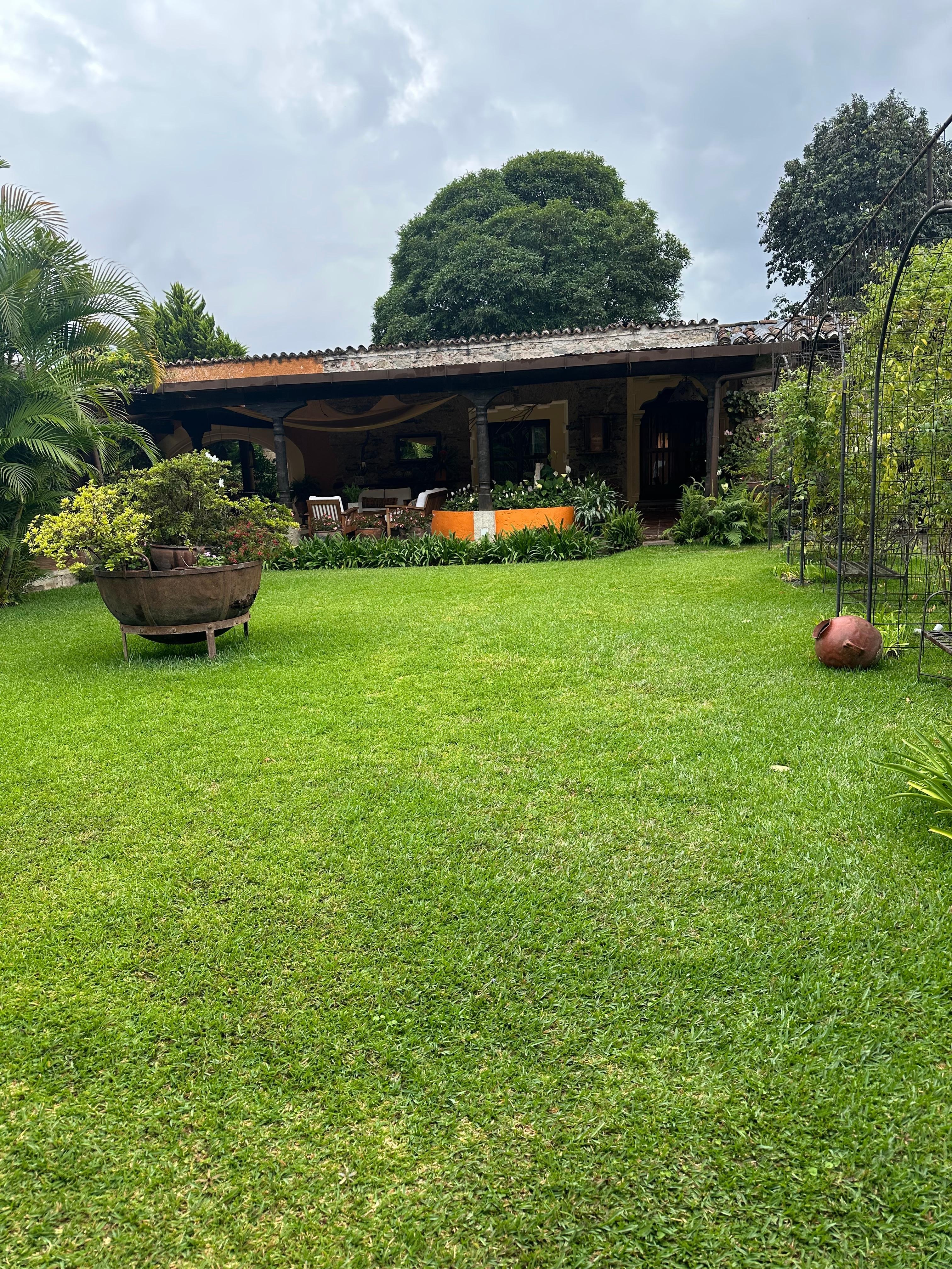 The lawn outside Room 8 next to outdoor covered patio.