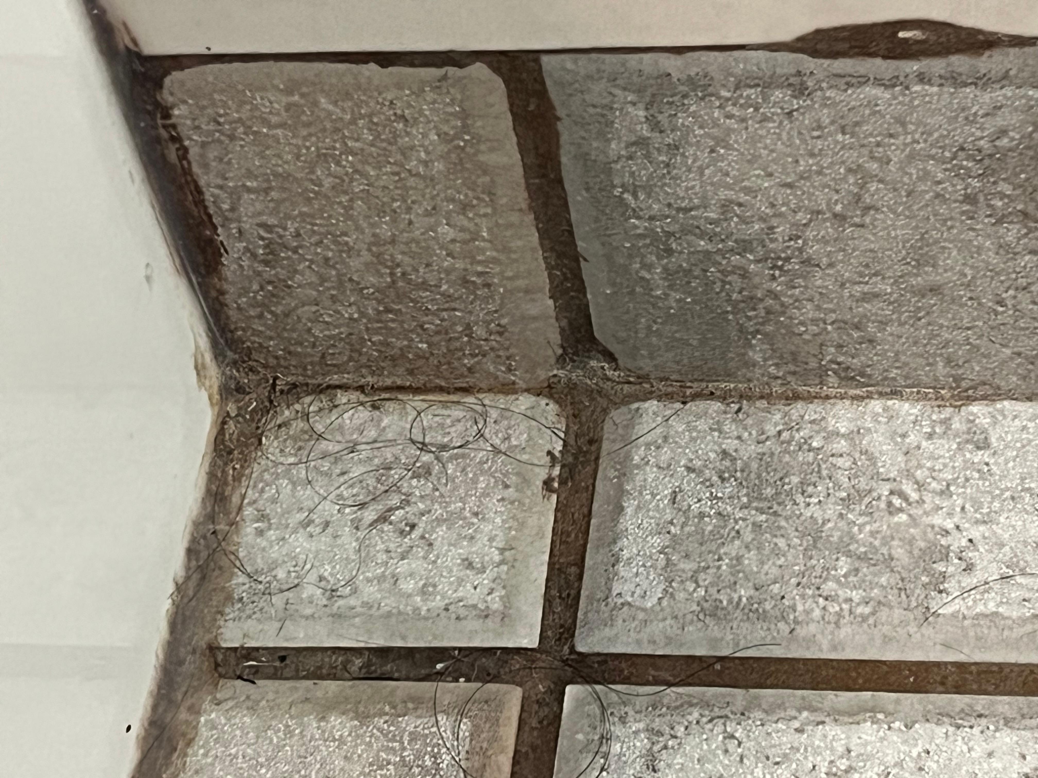 Unclean bathroom floor of Hotel Room upon arrival.