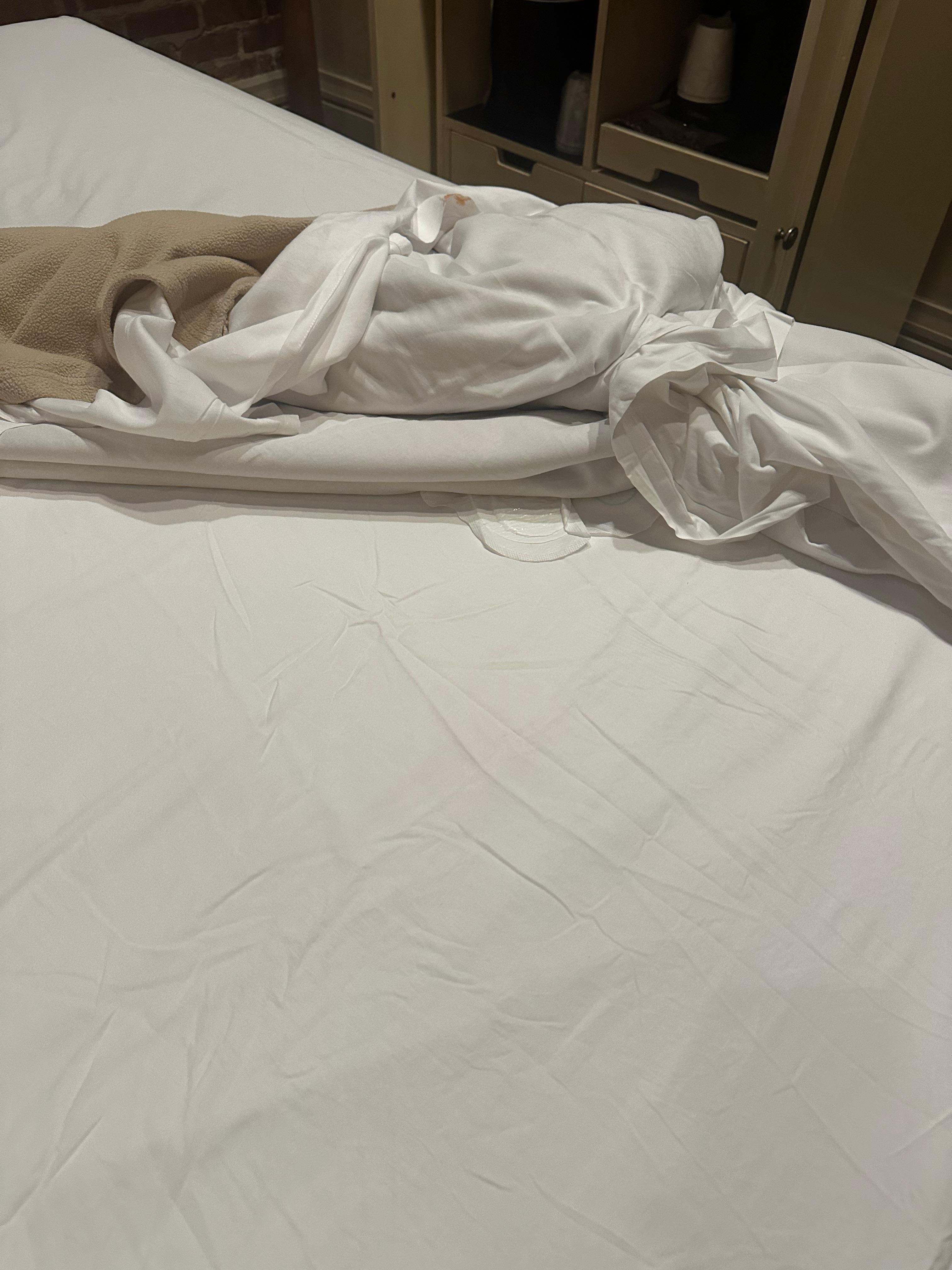 When I went to bed after diving for hours, my bare-FEET found this used female-pad in the sheets.