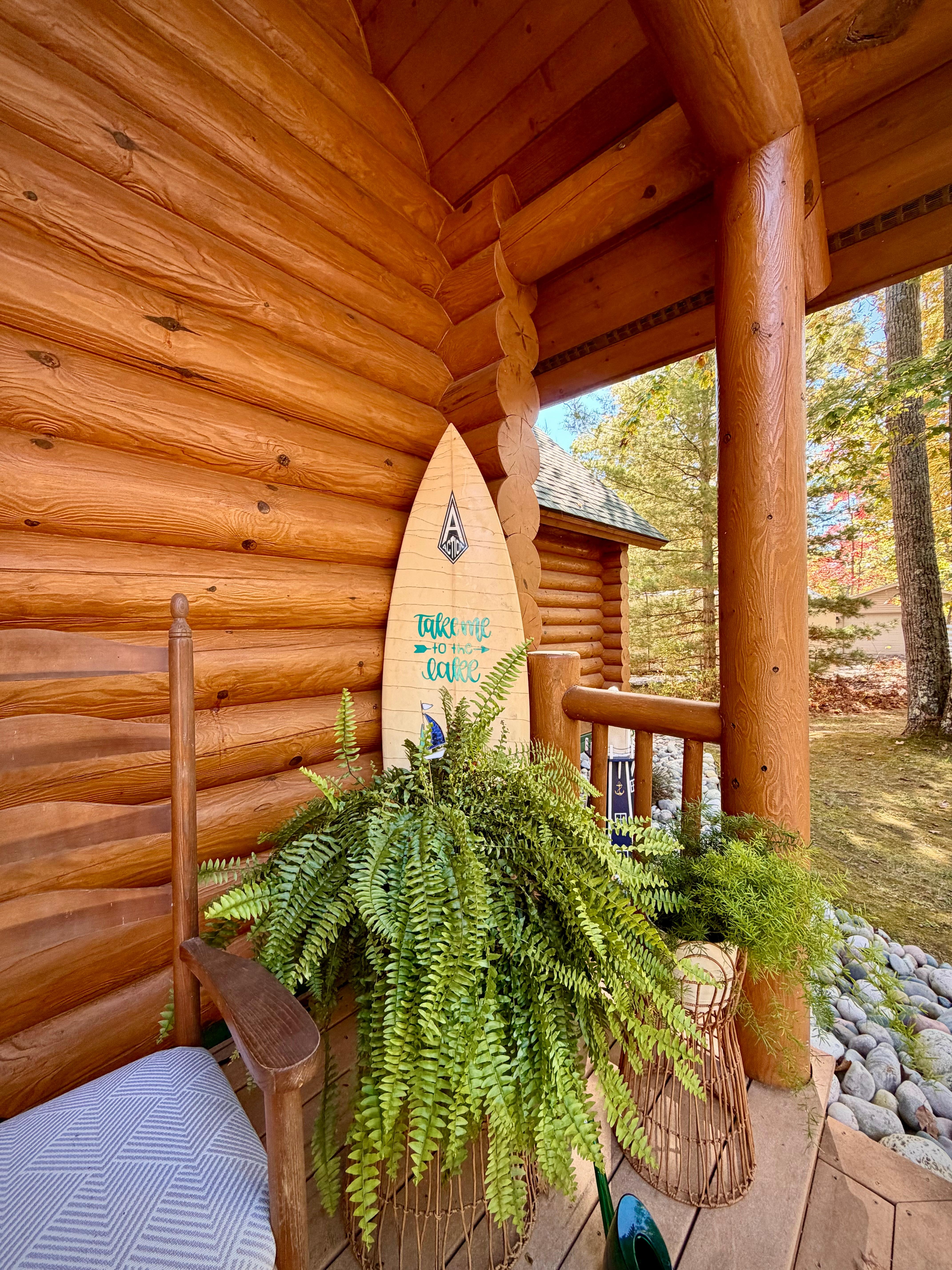 Super cute porch with a beautiful fern. 