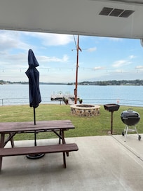 Picnic table, fire pit, grill, and dock outside the room.
