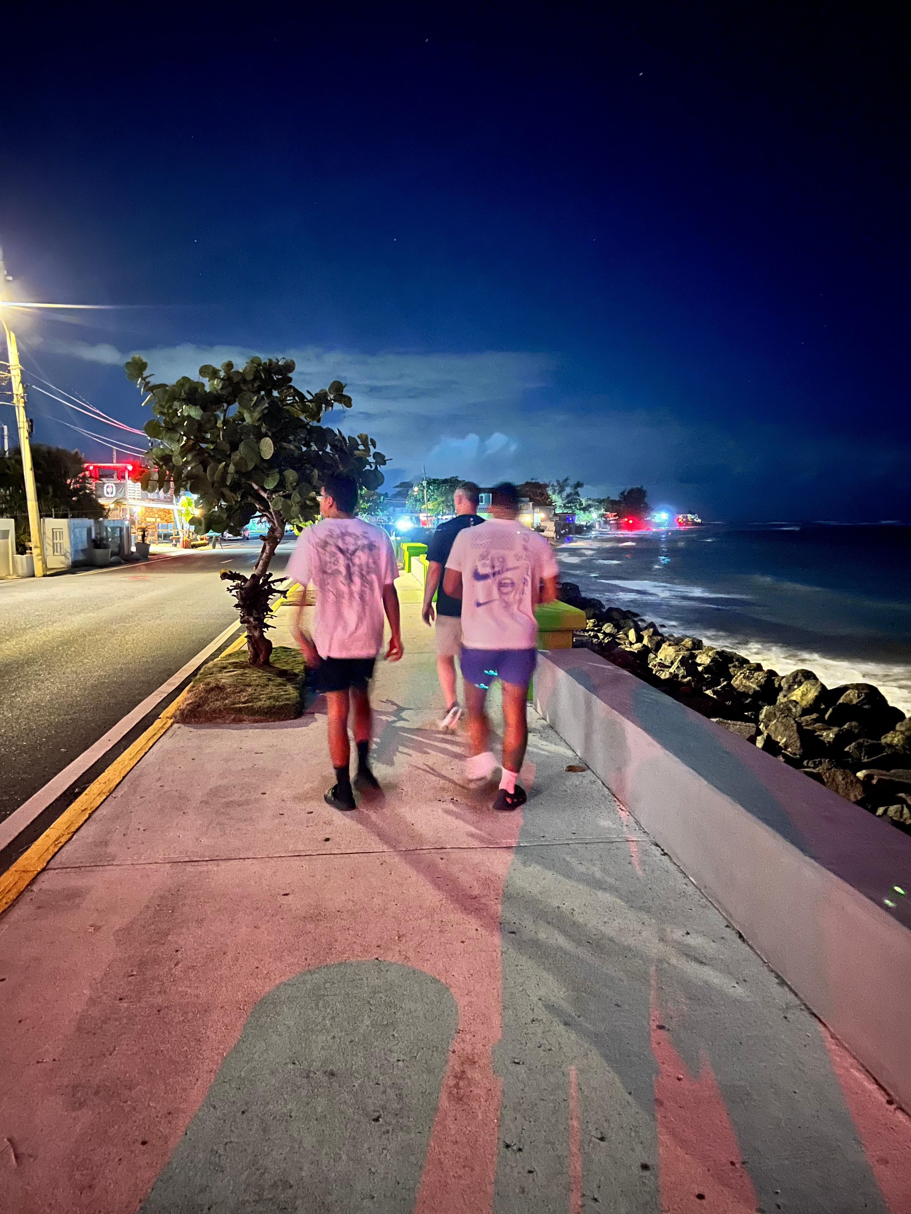 Walking back from a local restaurant, along the ocean.