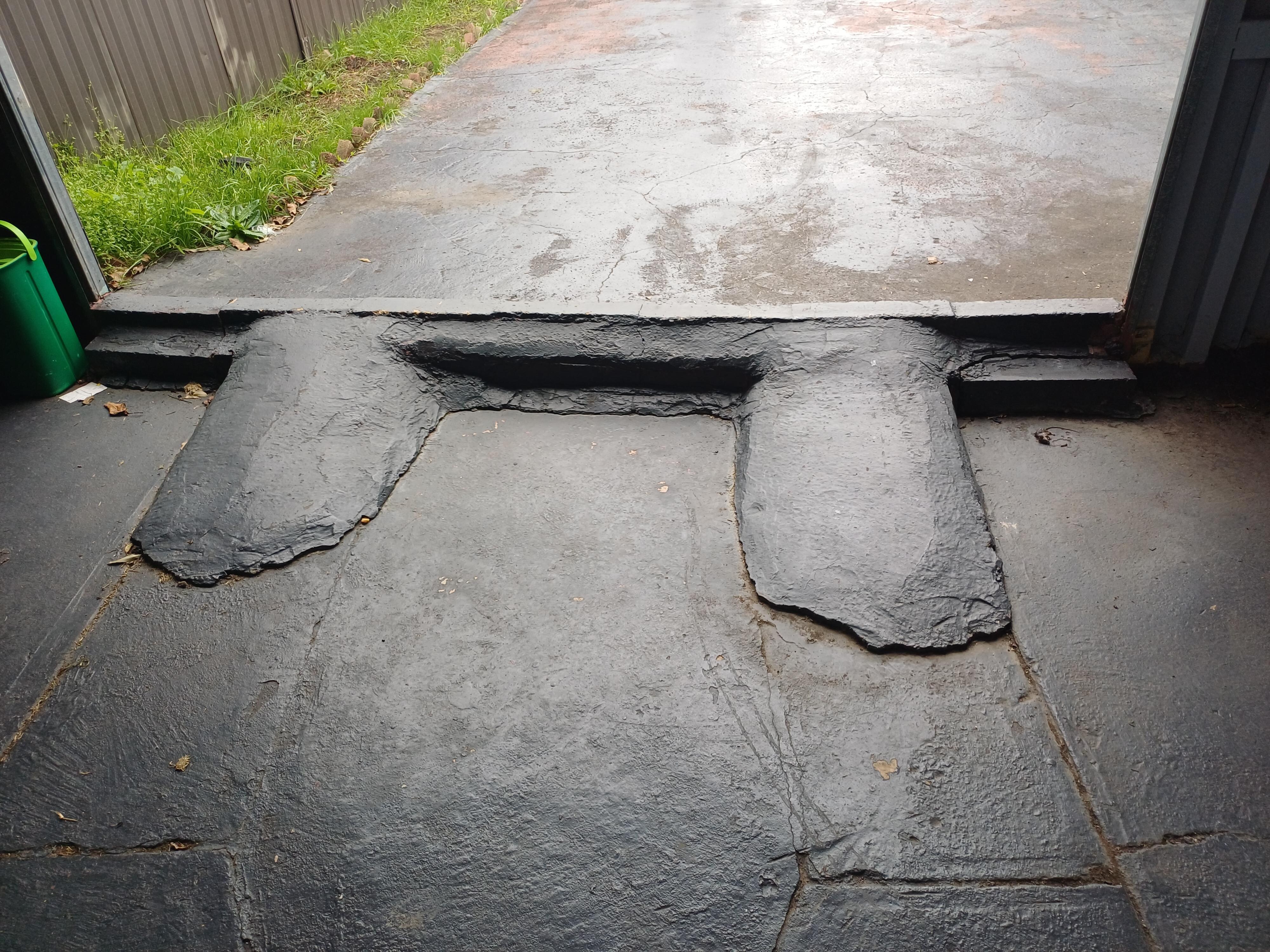 Trip hazard trying to walk in the dark into a garage for access. So bad. No lights..