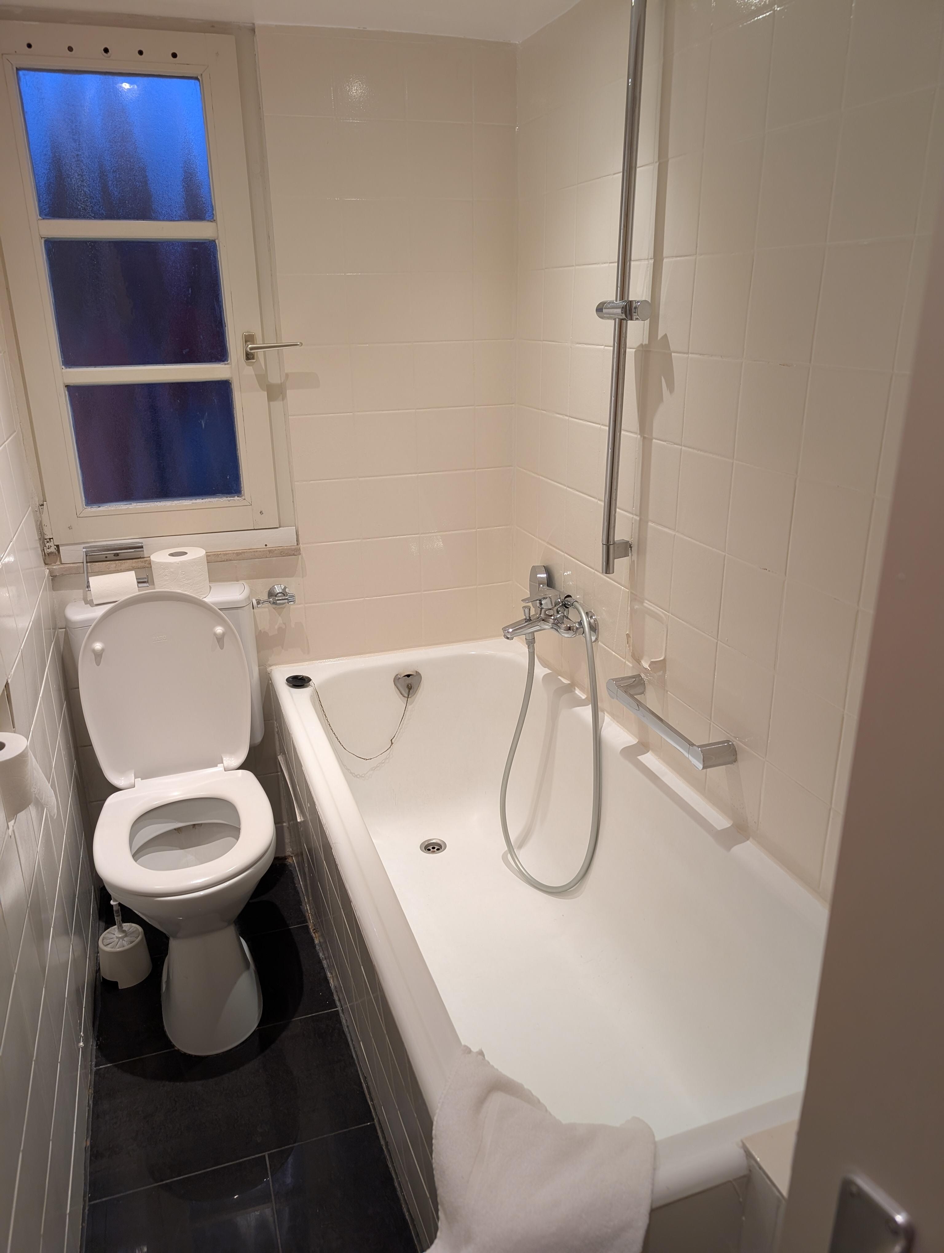 no shower curtain, broken (dangerously sharp) soap dish, urine smell from uncleaned areas beside toilet.