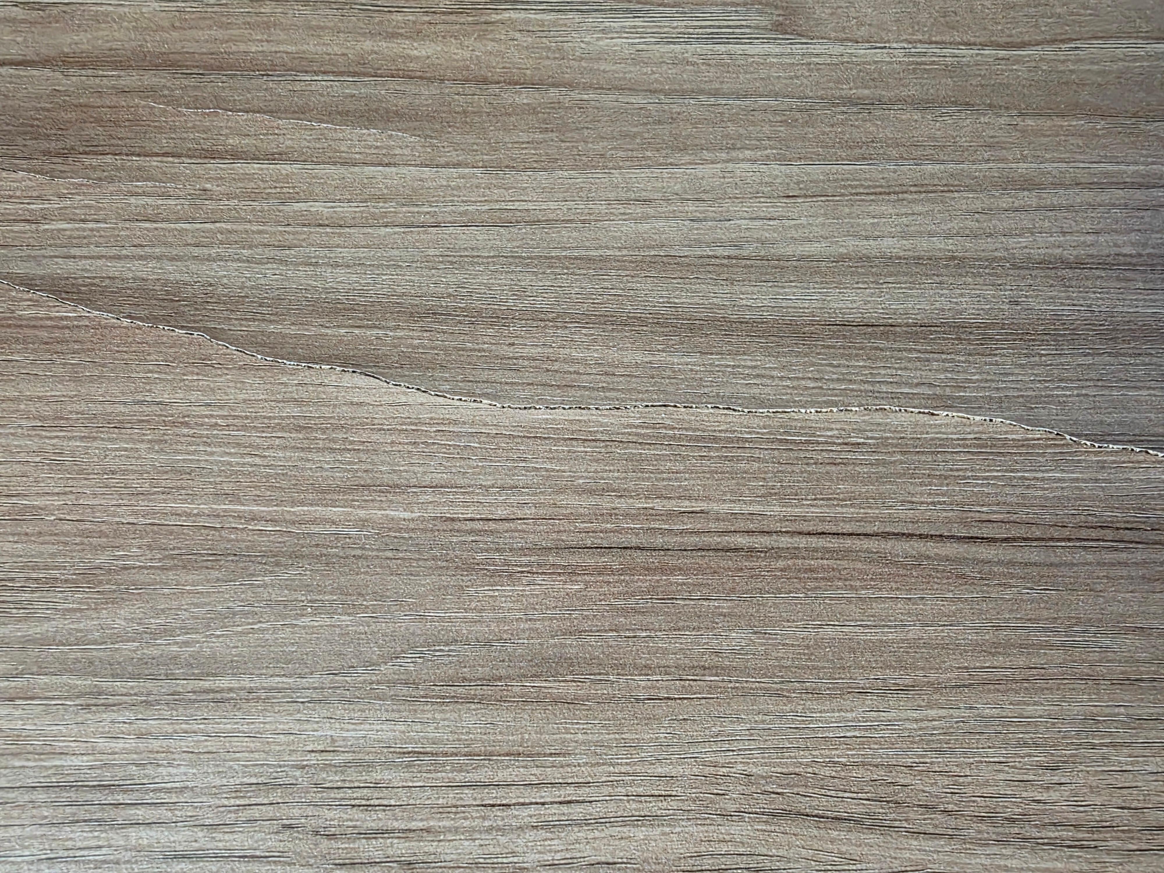 Faux wood furniture was warped and damaged from water.