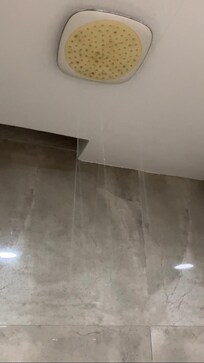 Barely functioning shower head in the bathroom