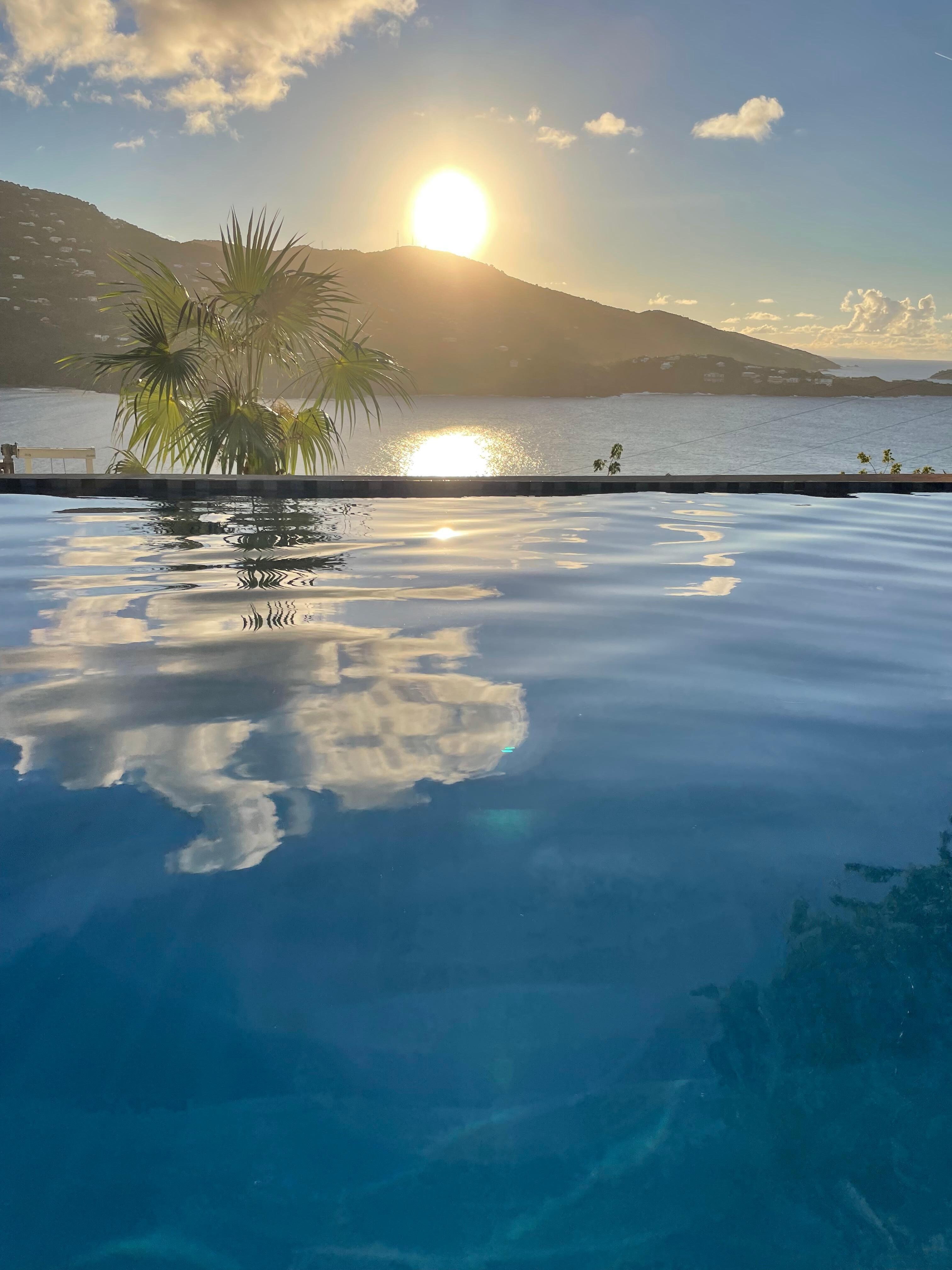 view from pool at sunset