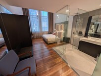 Note the all-glass shower stall with no curtains or shades.