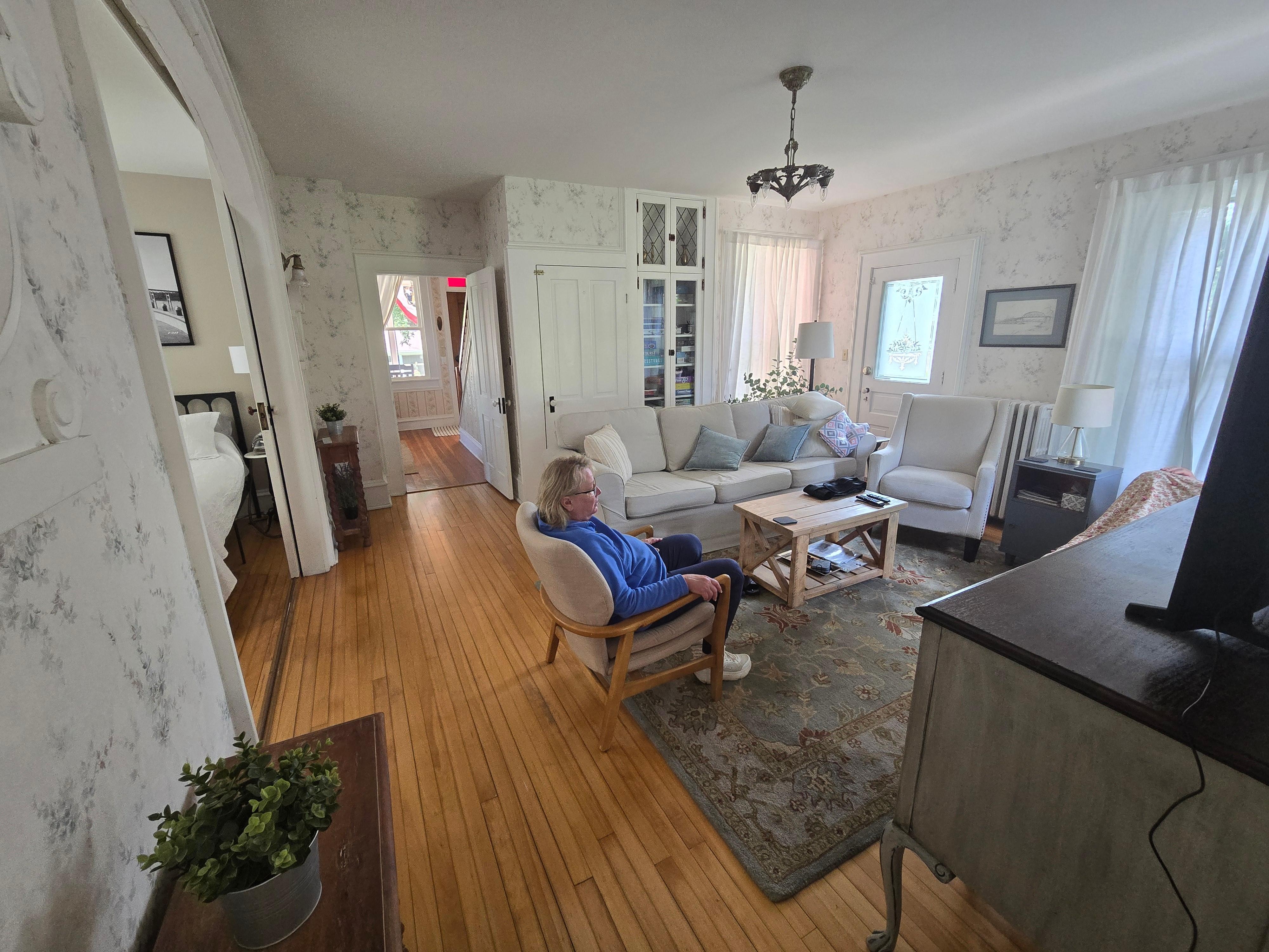 Living room with main level bedroom and 1/2 bath to the left.