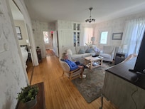 Living room with main level bedroom and 1/2 bath to the left.