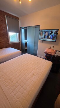 TINY room hardly any space between beds and bathroom wall