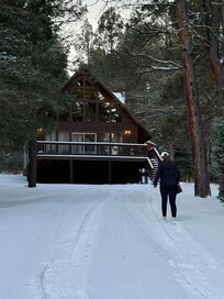 Walking to check out the property while waiting on the snowplow