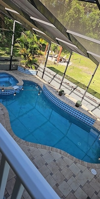 Views of the pool and hot tub from the second floor balcony.