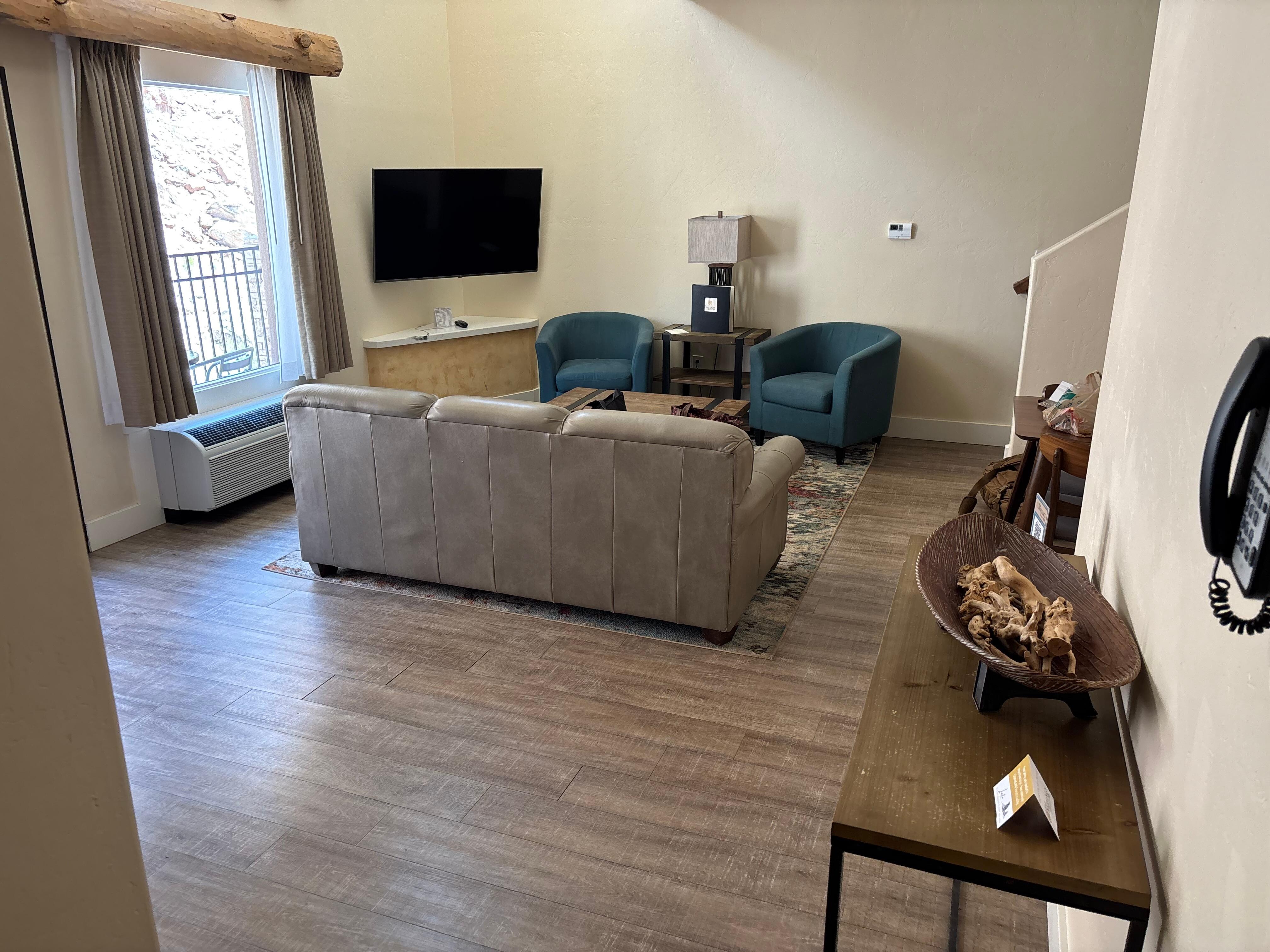 Living room and dining area in the 2 bedroom suite
