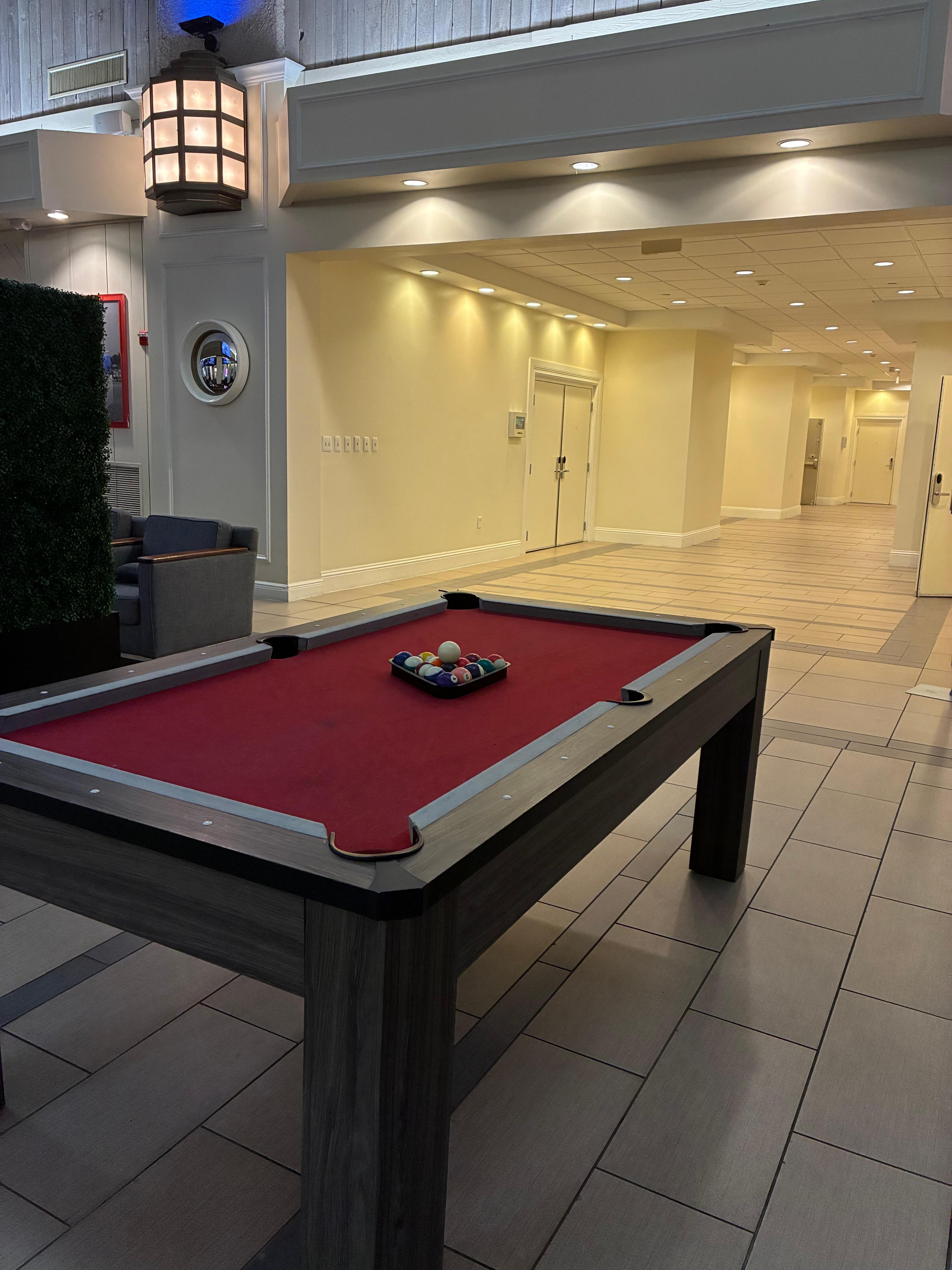 We played pool in the lobby area right next to the bar across from the hotel gift store. 