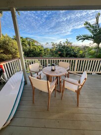 Dining table with peak-a-boo view to ocean