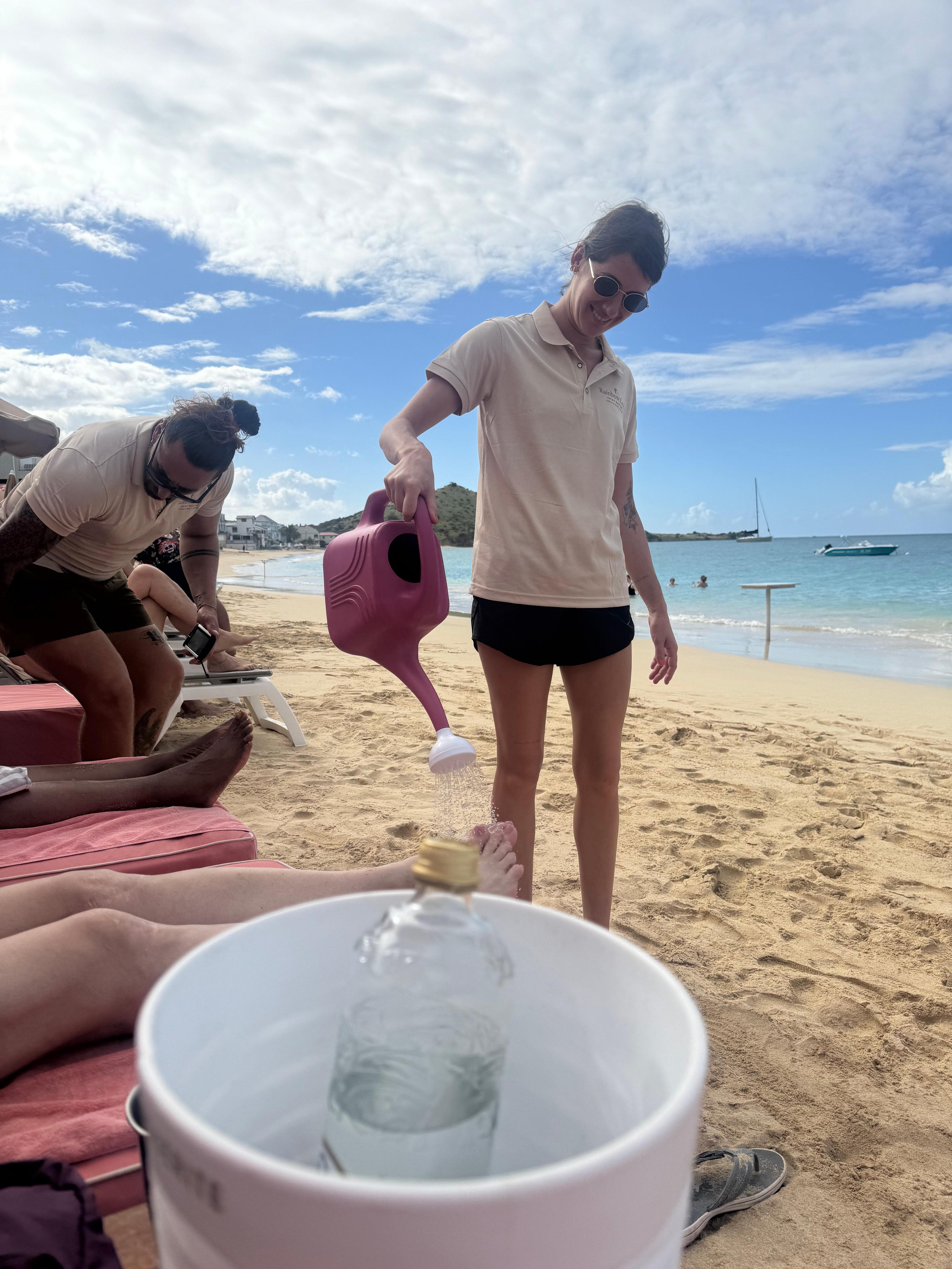 At the rainbow getting our feet washed off after getting out of the ocean 