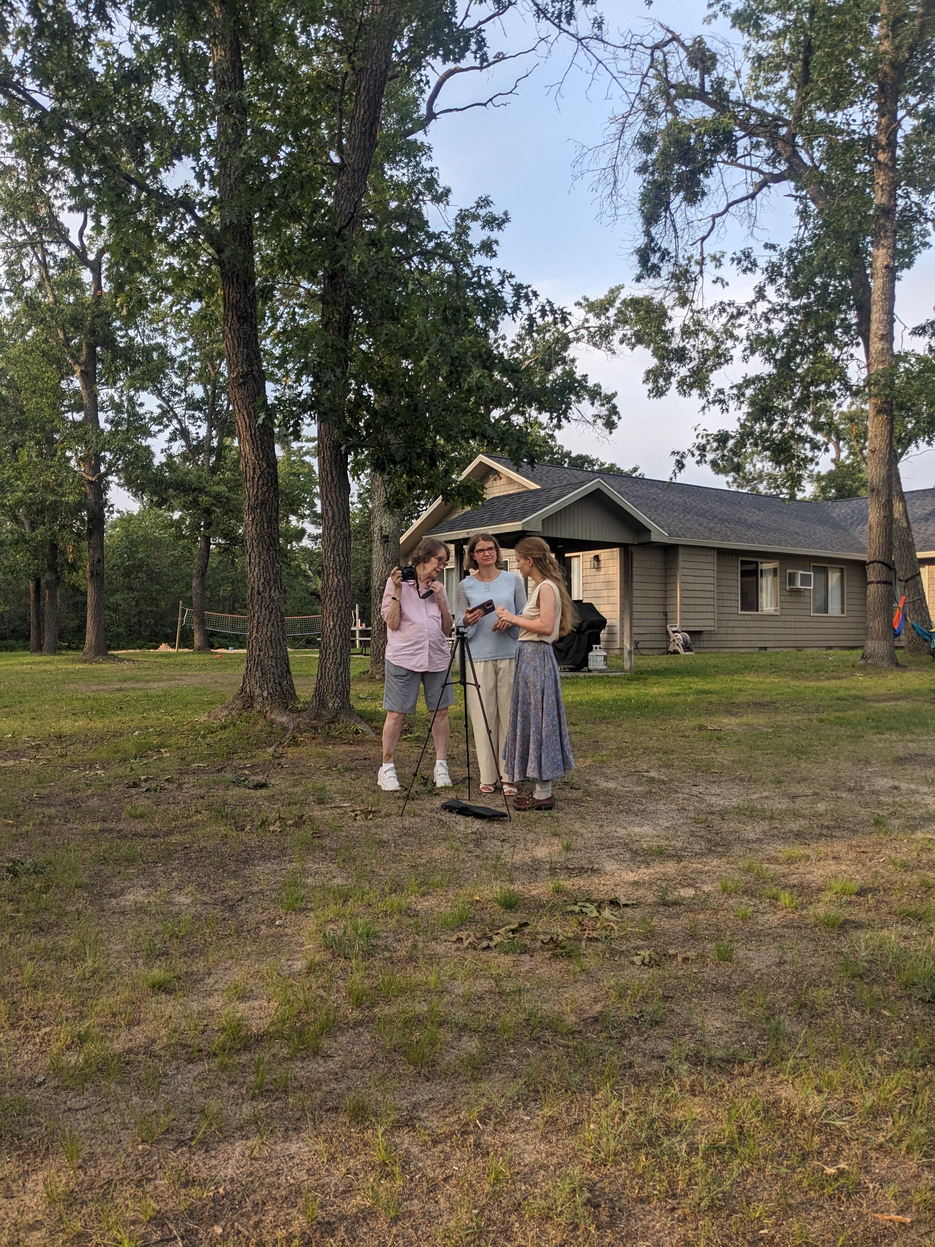 Getting ready for reunion pic
  Back of lodge.  Volley ball and horseshoes in the distance.