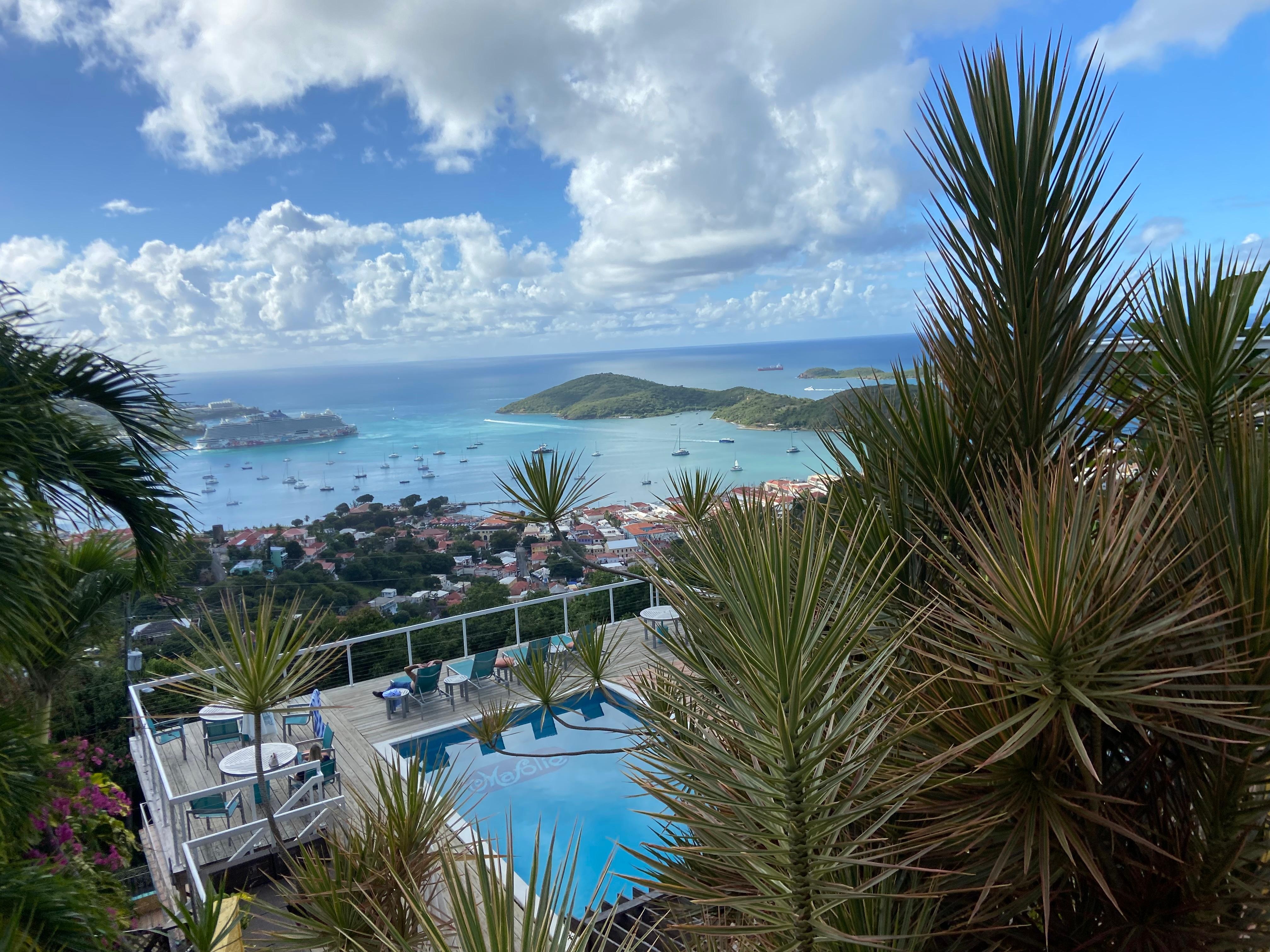 view of the pool over looking the city and port