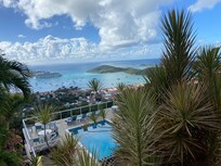 view of the pool over looking the city and port