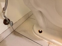 Rust and staining at toilet base