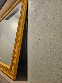 Mirror leaning on wall