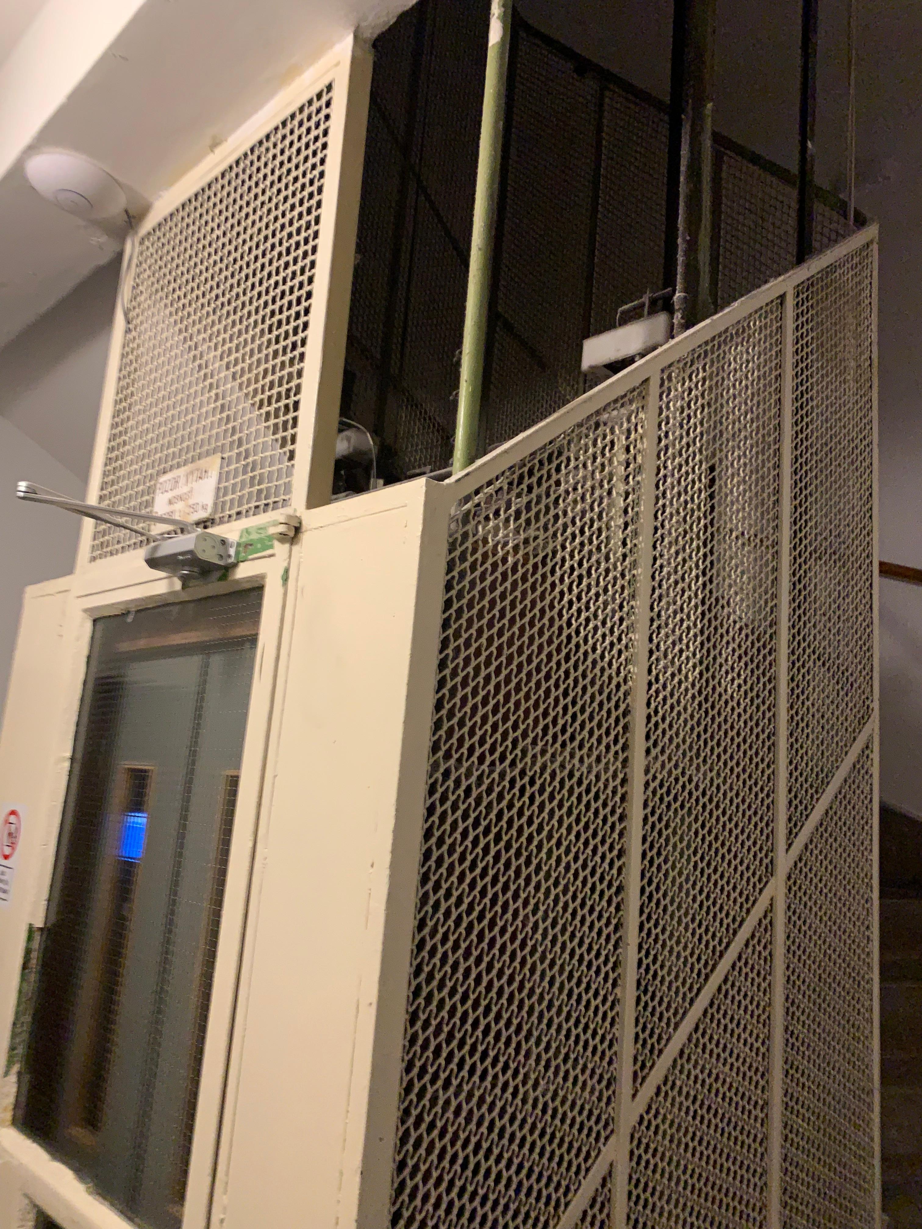 One very small lift max 2 people servicing 6 floors