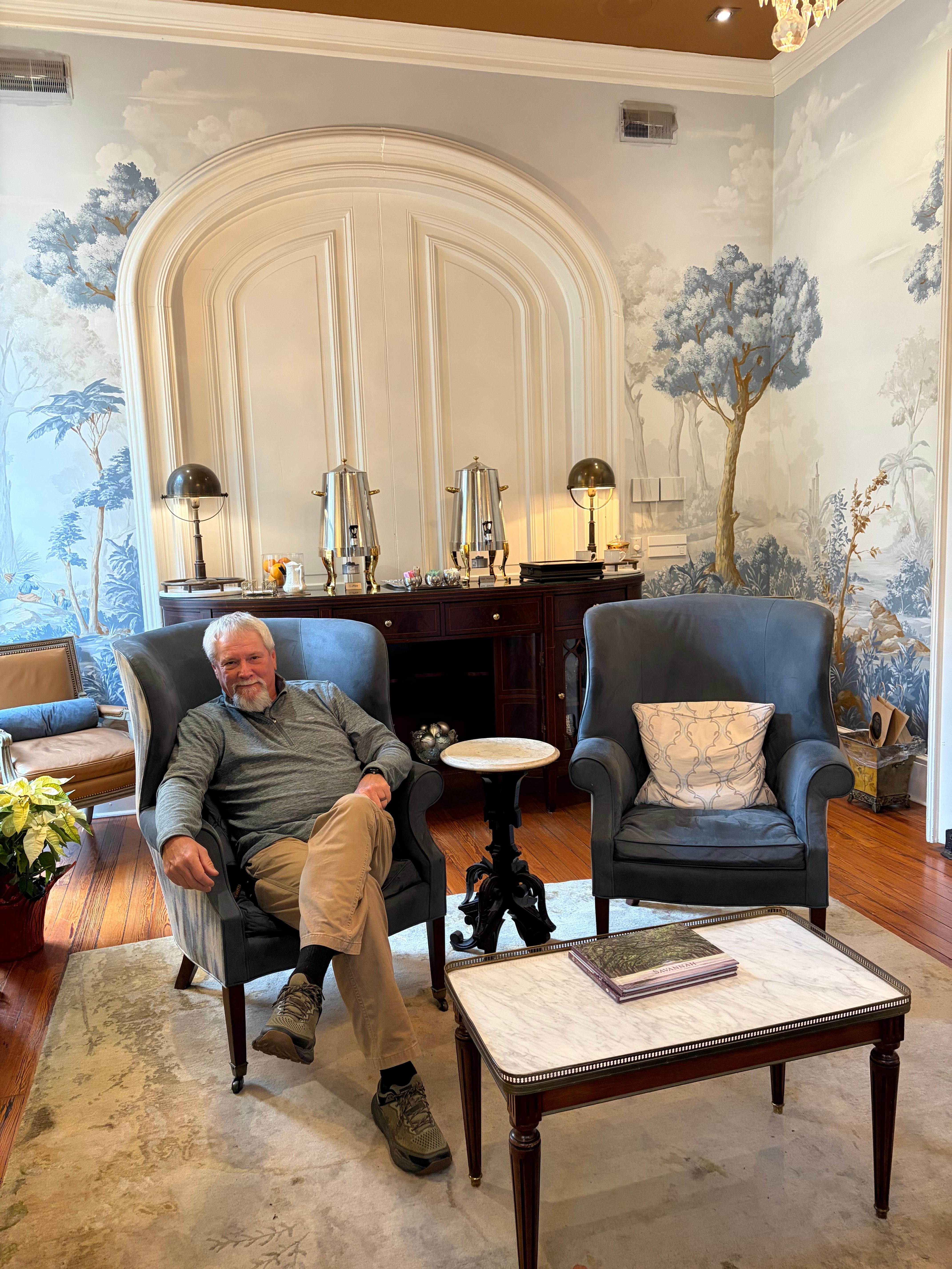 Having a cup of coffee by the fire.