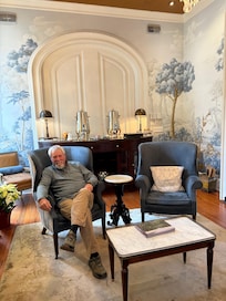 Having a cup of coffee by the fire.