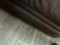 Right side of couch on the floor