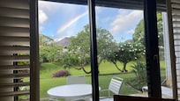 View out the back door of condo while eating at the kitchen table.