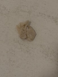 Gauze pad on bathtub floor