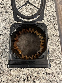 Coffee filter not removed - used grounds found