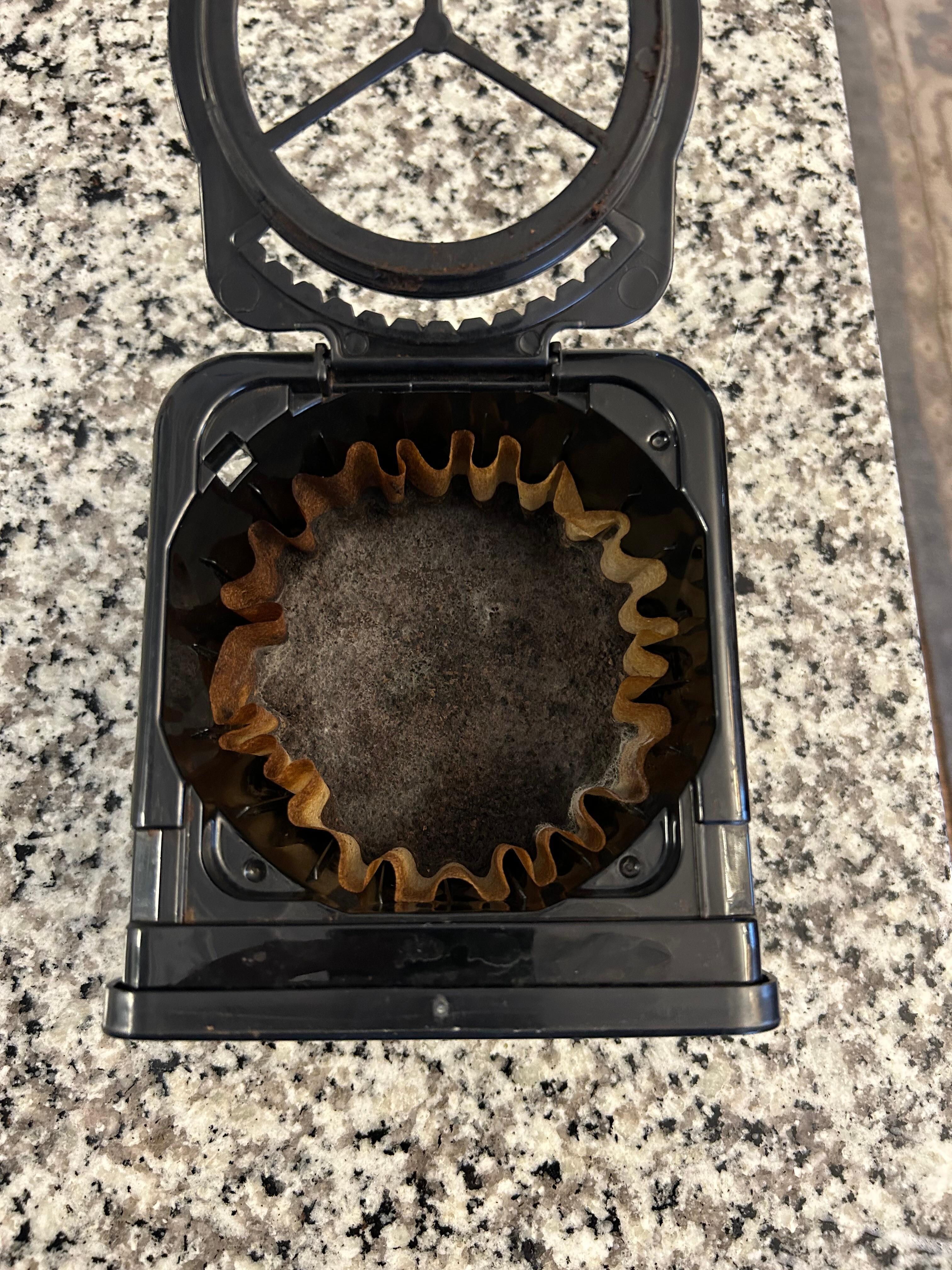 Coffee filter not removed - used grounds found