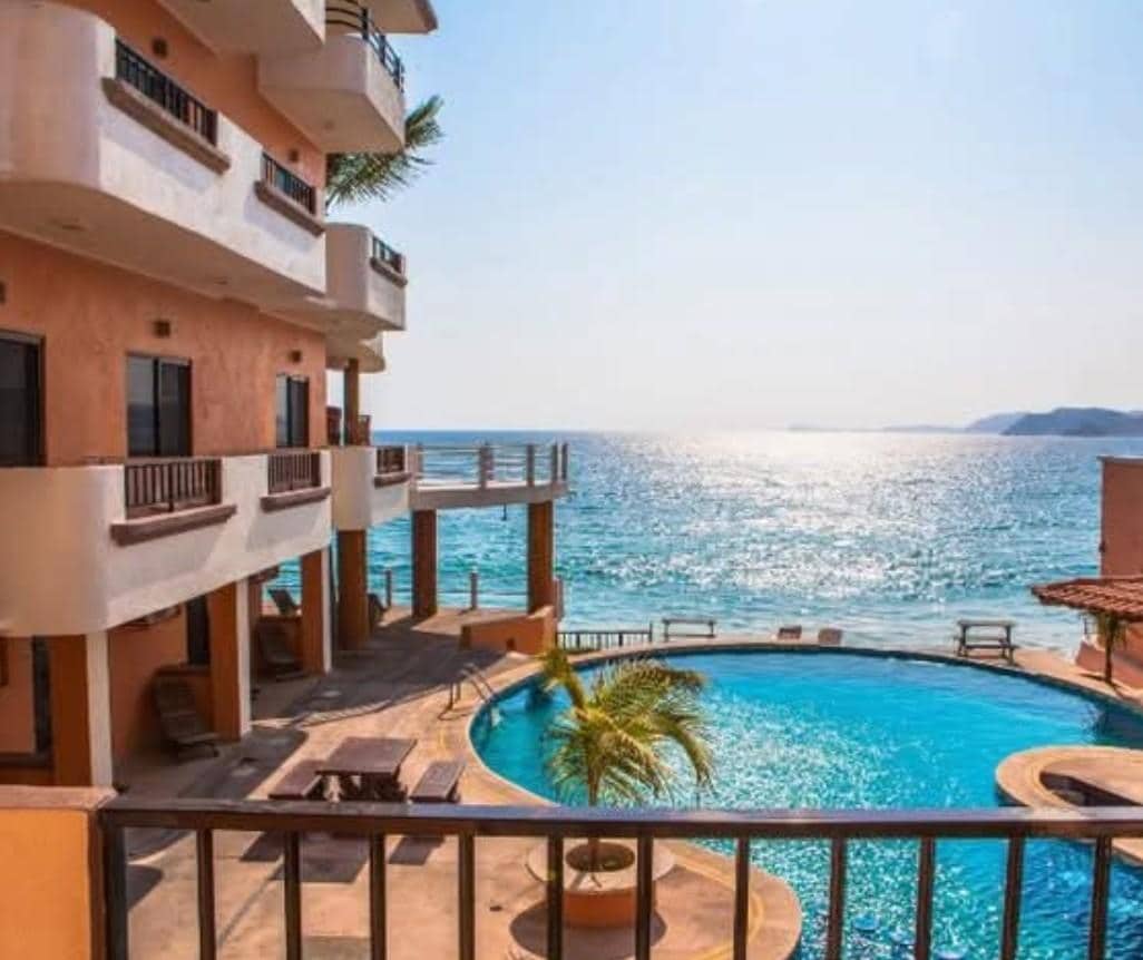 Beautiful pool area with lots of seating overlooking ocean