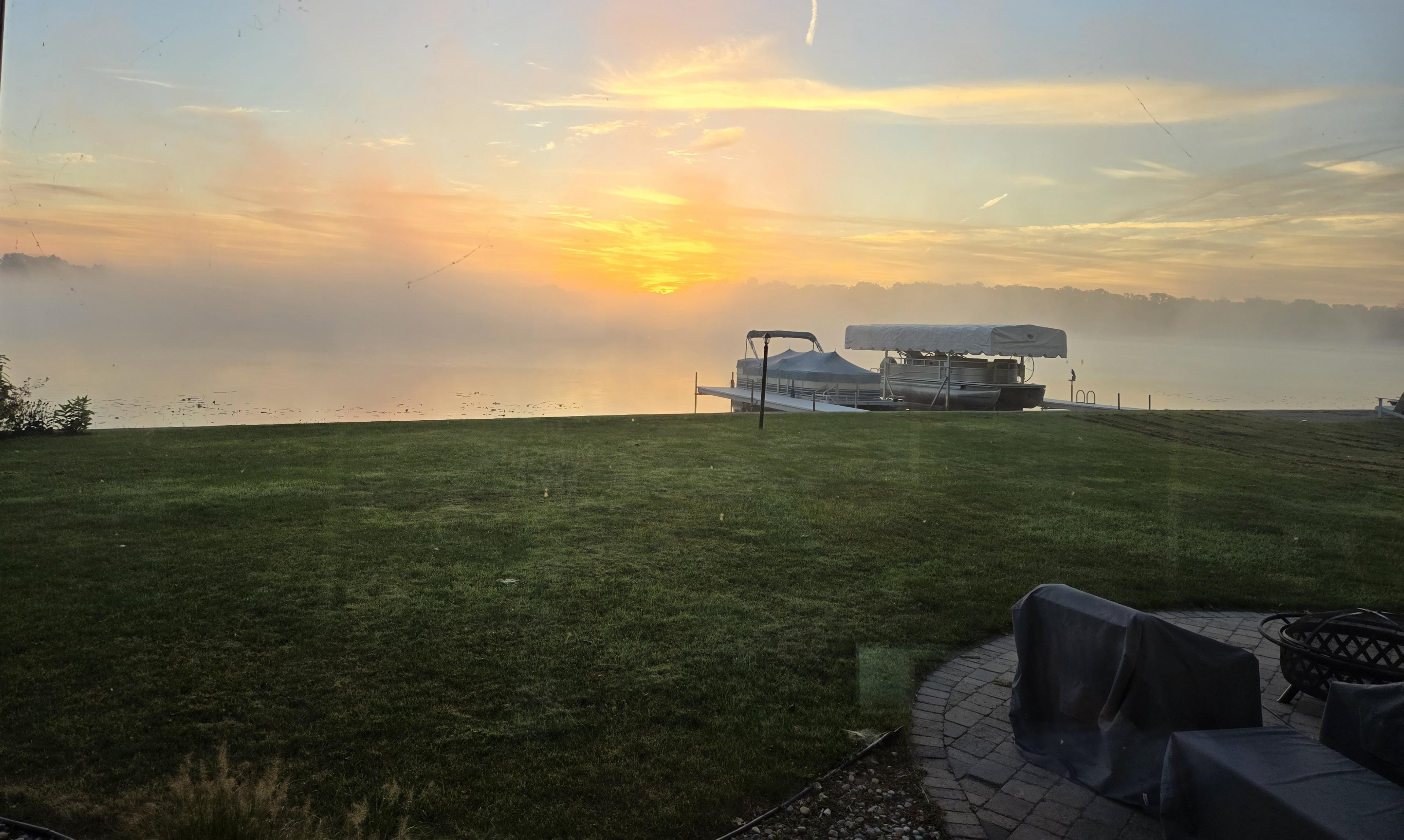 A foggy October sunrise over the lake.