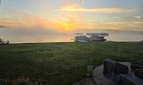 A foggy October sunrise over the lake.