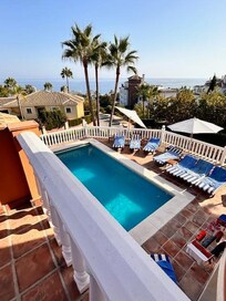 Pool area and sea view from bedroom balcony