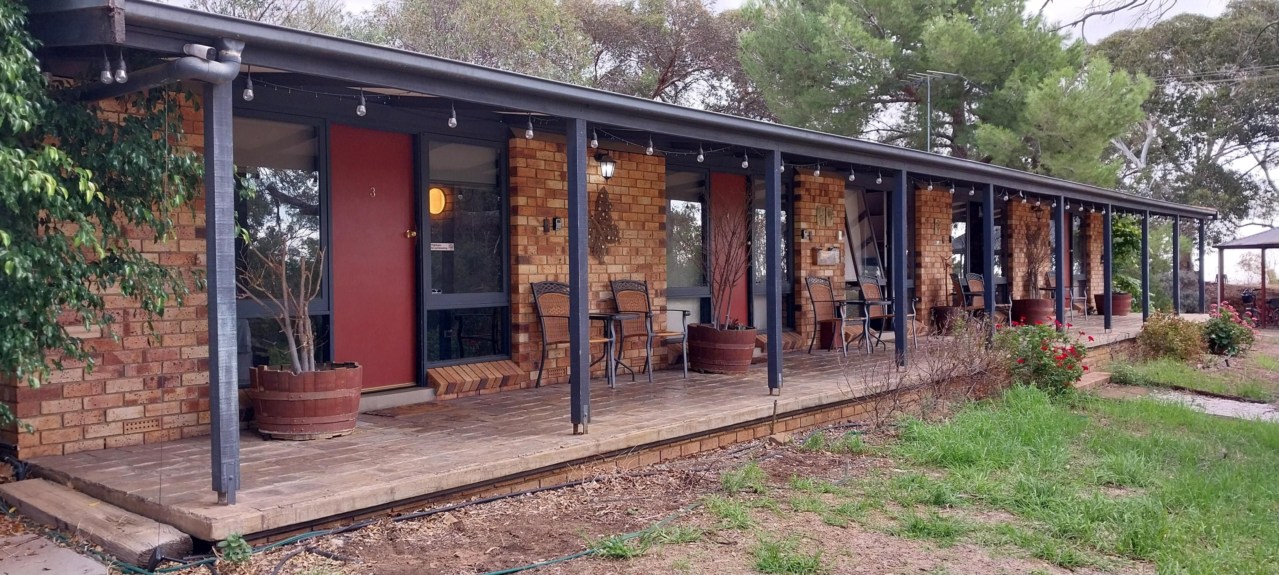 Front of 4 rooms (with laundry room in the middle). 