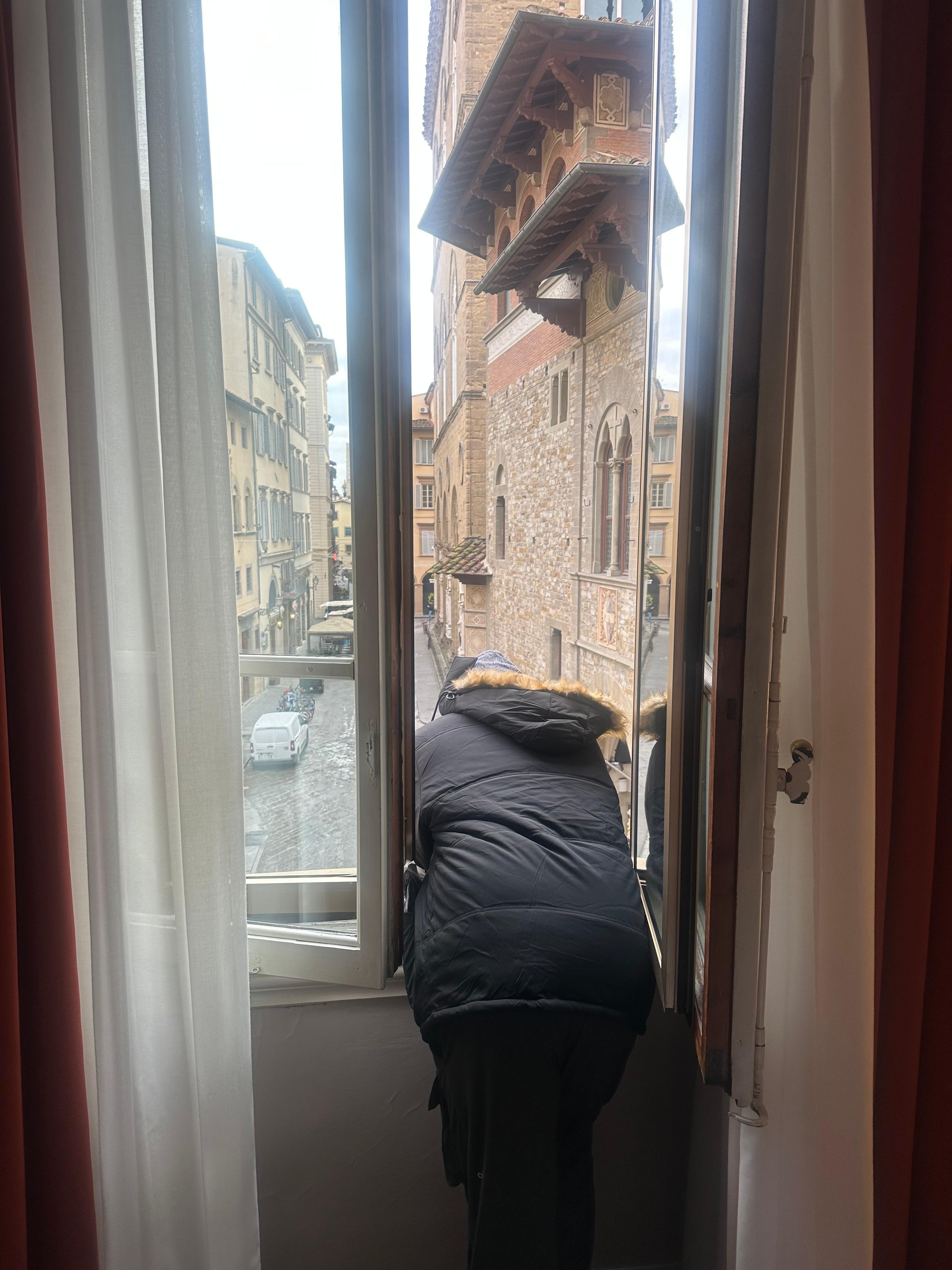 Husband enjoying the view from our window