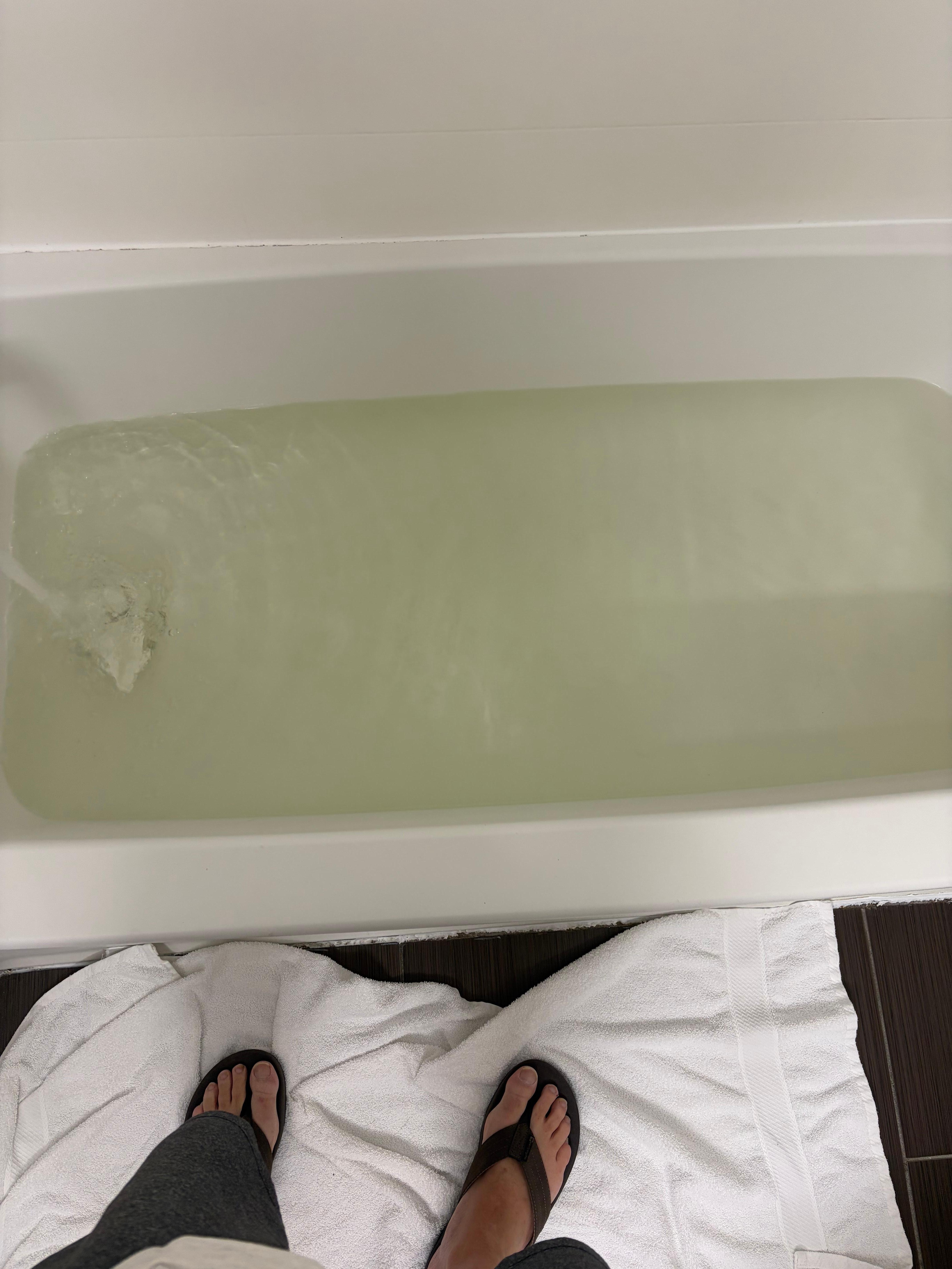 Room 120 has brown tub water and no stopper. 