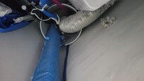 Vent line from Gas Dryer exhausting into a plastic Ice cream bucket