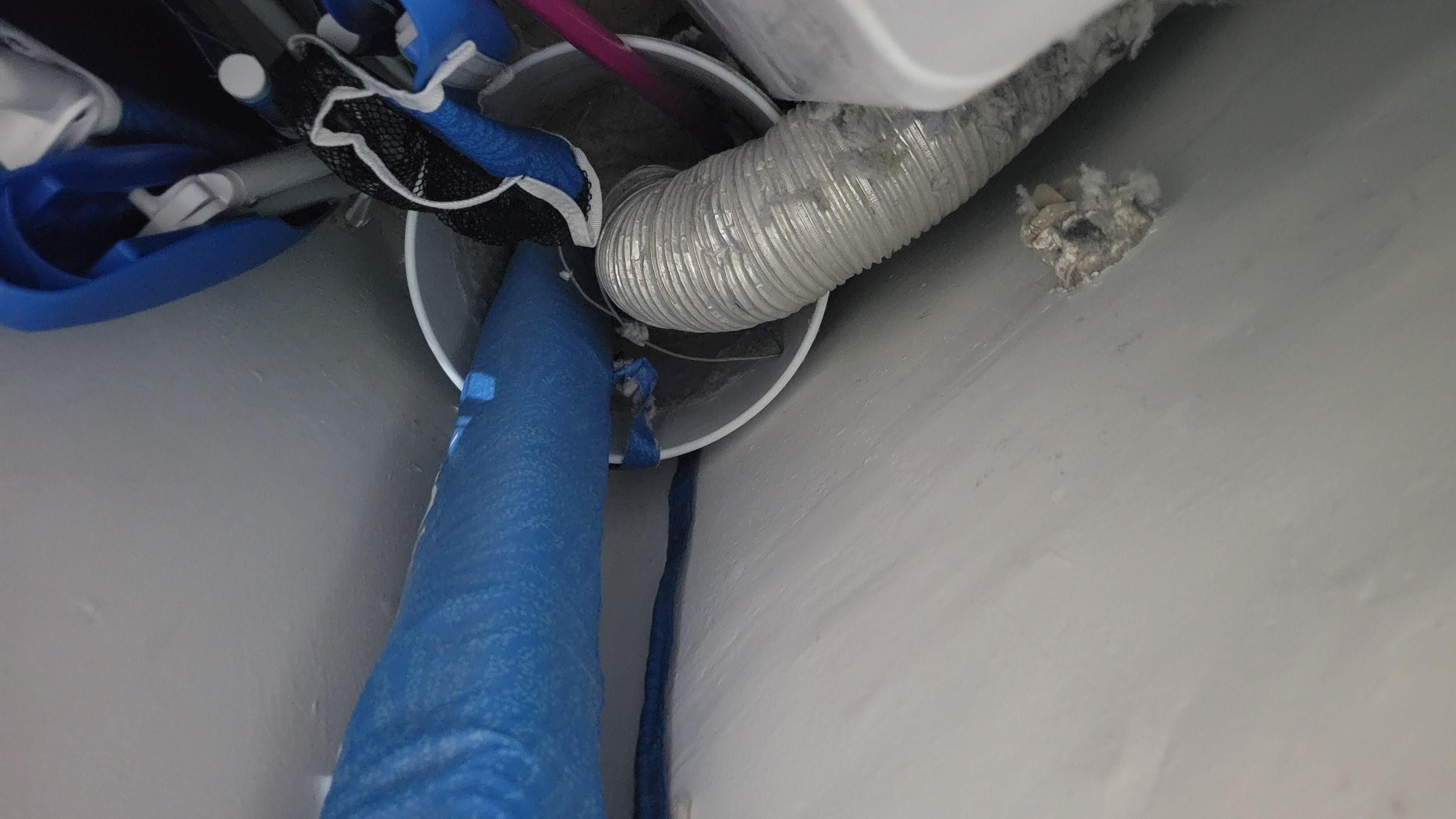 Vent line from Gas Dryer exhausting into a plastic Ice cream bucket